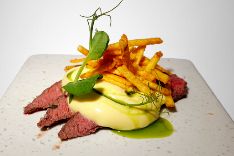 Flat iron steak with hollandaise, tarragon oil and 'fries'