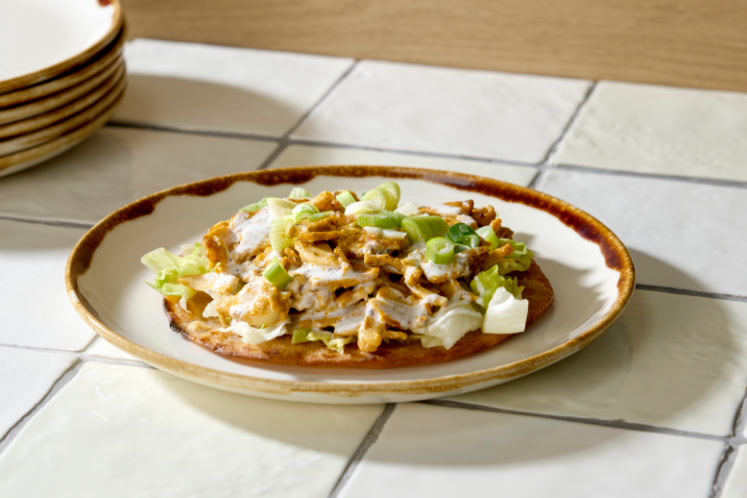 Paratha met butter chicken